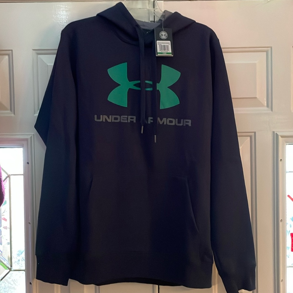Dark blue, Under Armour sweatshirt with green insignia on the chest. Size large